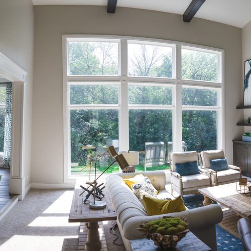 A beautiful home interior full of natural lighting exhibits the design capabilities of Verdigris Interior Design.